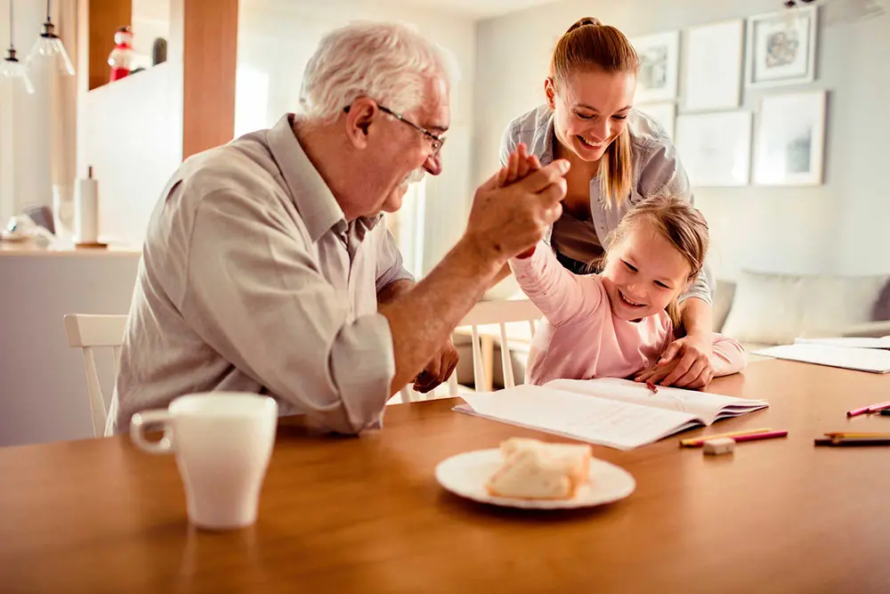 Grandfather at Kitchen table with granddaughter